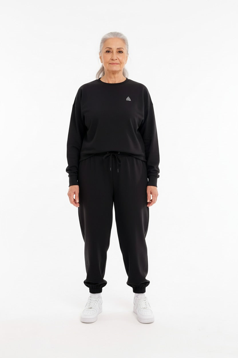 ComfortCure Alzheimer bakım tulumu siyah renk kadın model üst gövde önden görünüm