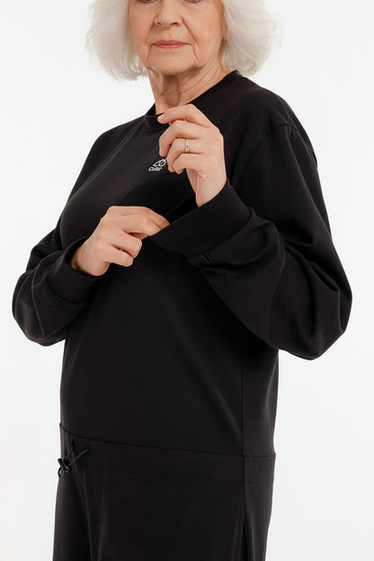 ComfortCure demans bakım tulumu siyah renk kadın model arka fermuar açık güvenli tasarım