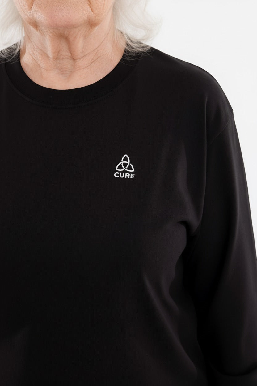 ComfortCure demans bakım tulumu siyah renk kadın model bel hizası detay görünümü